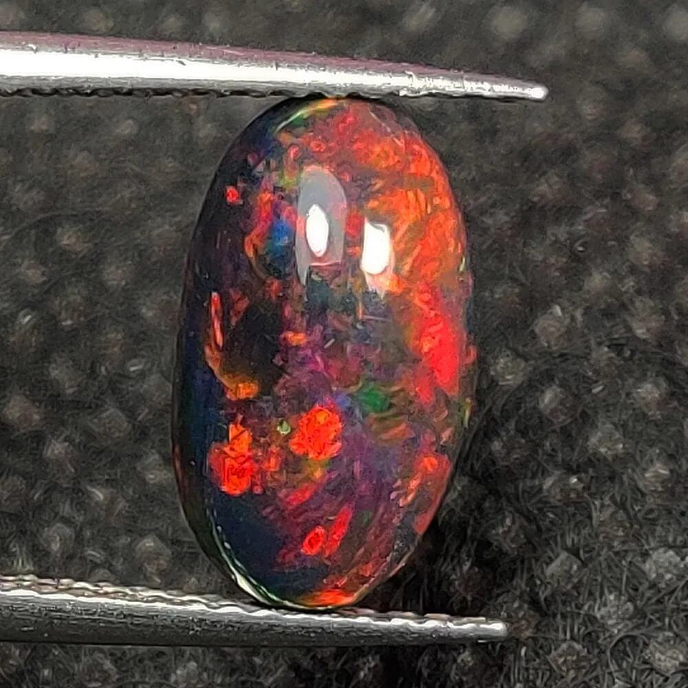 1.60 Ct Natural Black Fire Opal Oval Cab, Ethiopia